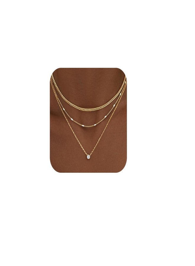 مجموعة مجوهرات WomenGifts النسائية، عبارة عن قلادات ذهبية متعددة الطبقات مطلية بالذهب عيار 14 قيراطًا، مزينة بقلادة أنيقة مرصعة بأحجار الزركونيا المكعبة الرقيقة، وسلسلة كوبية سميكة قابلة للتكديس، ومجوهرات عصرية مقاومة للماء ولا تفقد بريقها. - Image 1